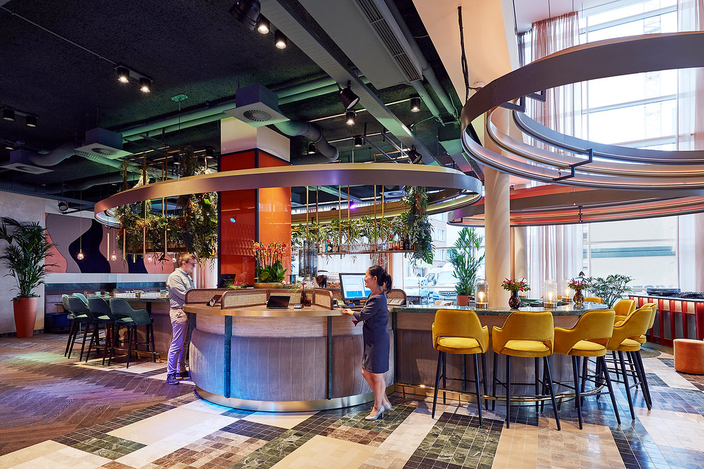 Modern hotel reception desk representing AI dynamic pricing and guest chatbots