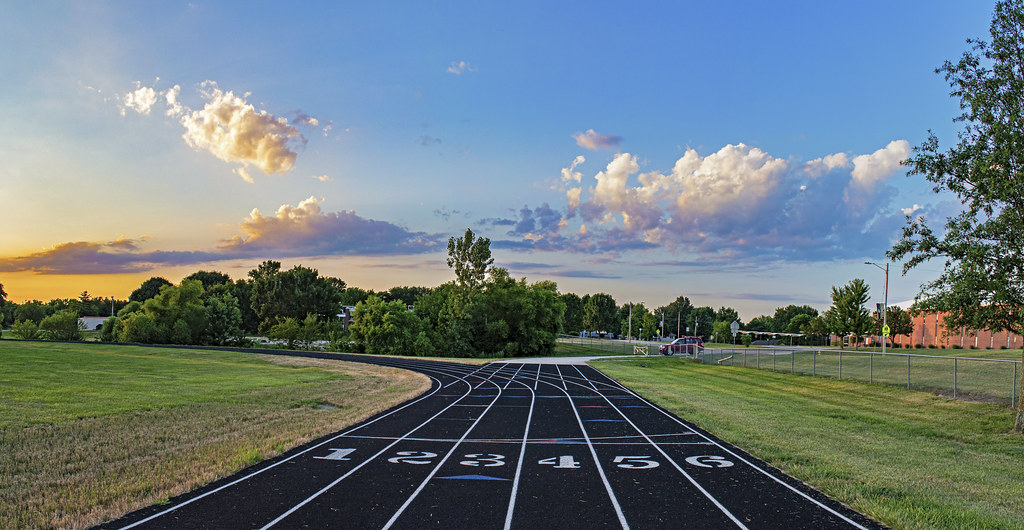 Sprinter running on an athletics track, representing AI predicting sports injuries