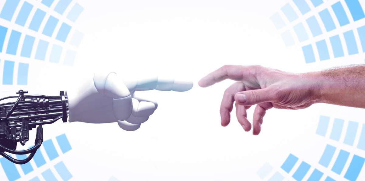 Human and robot hands meeting, illustrating why workers need to learn AI to keep their job