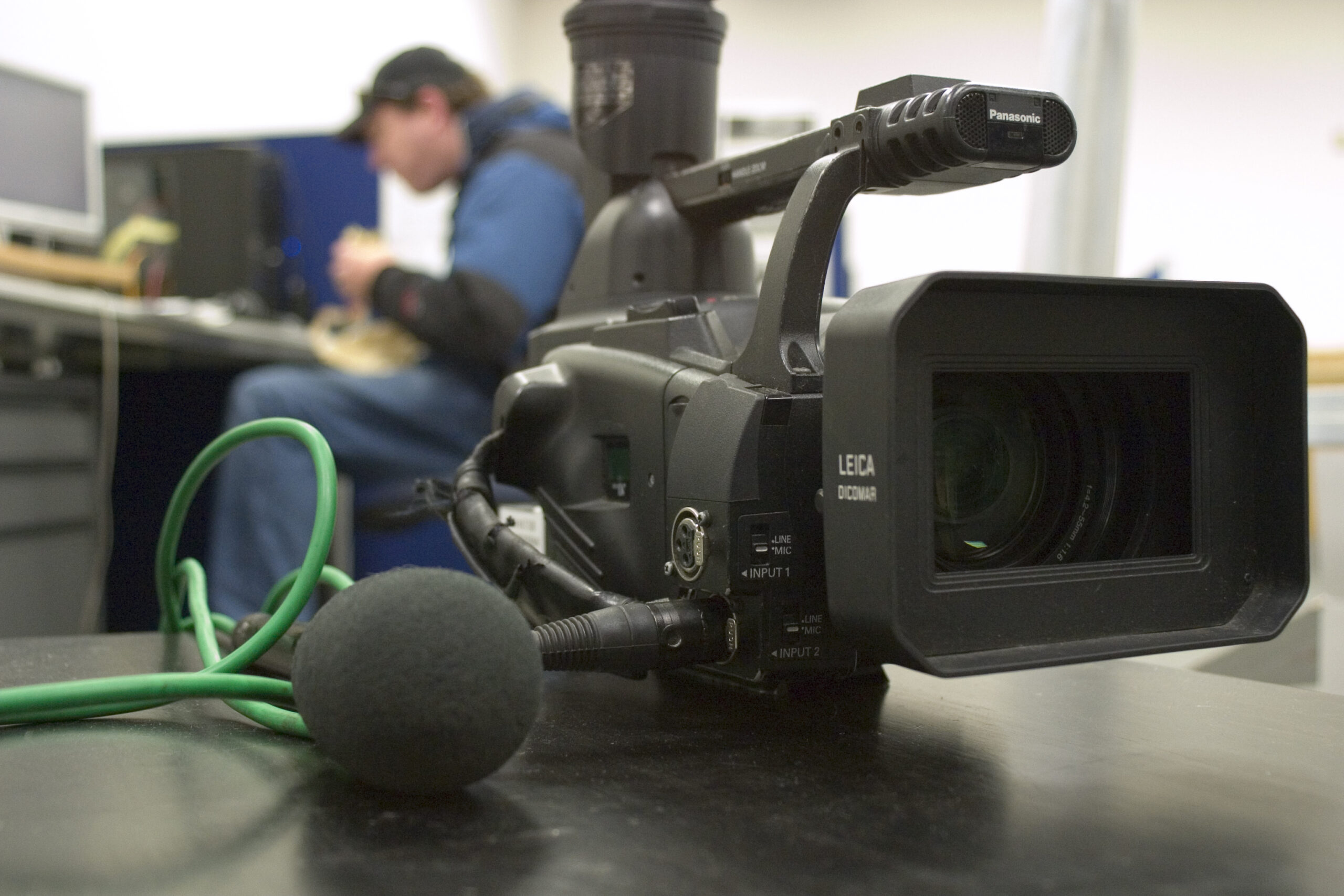 Video camera and microphone representing AI turning long video into short clips