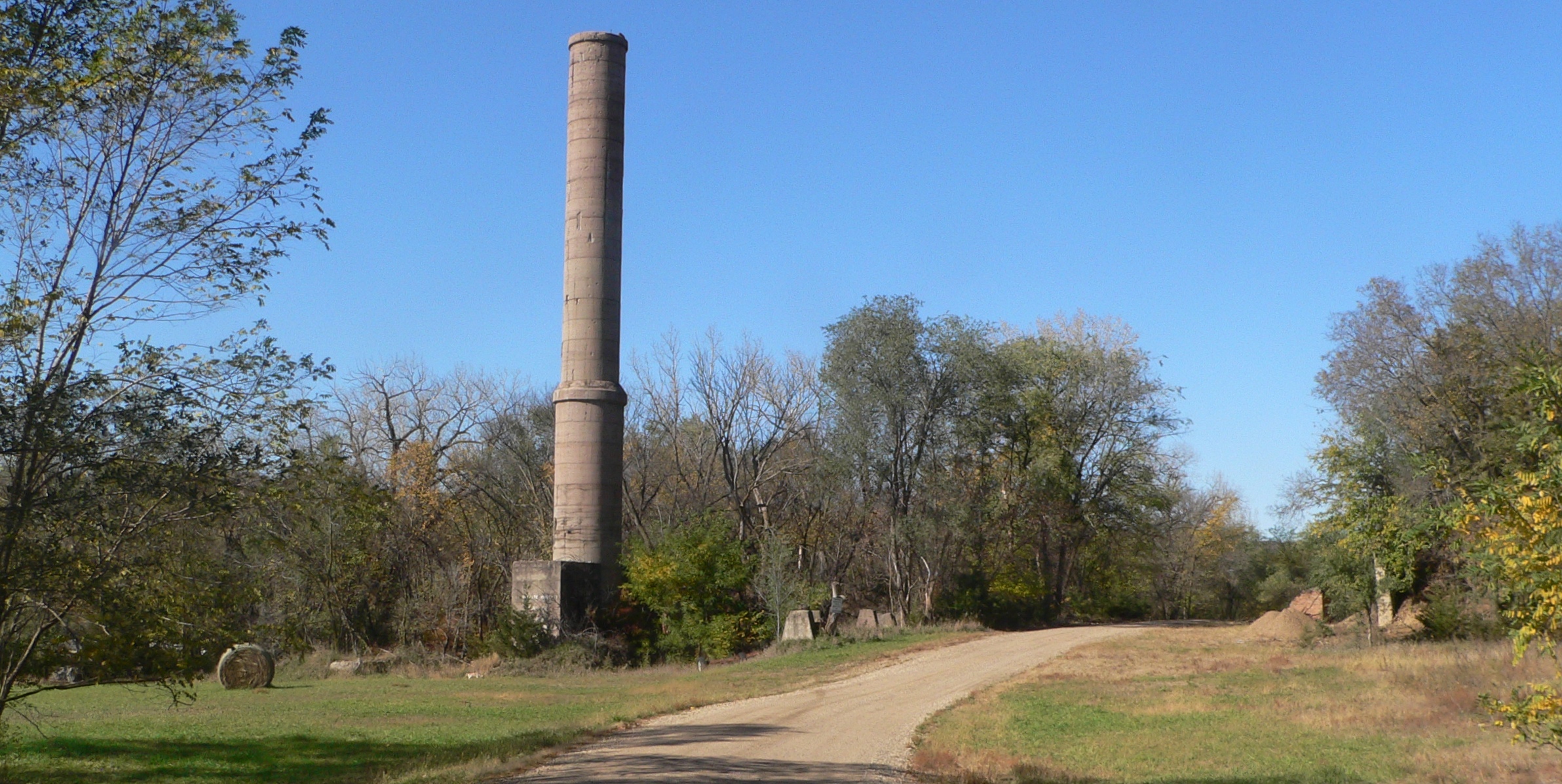 A cement plant with kiln and silos, the kind of heavy industry site where AI in cement manufacturing cuts fuel use