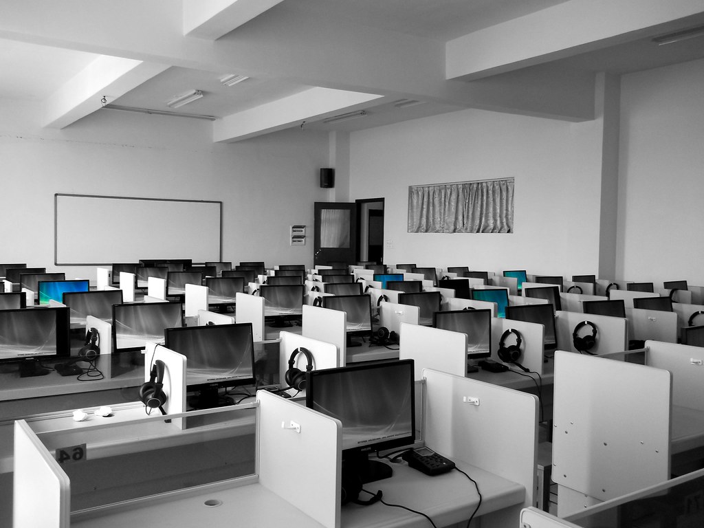 Rows of computers in a school lab, illustrating AI essay grading in classrooms