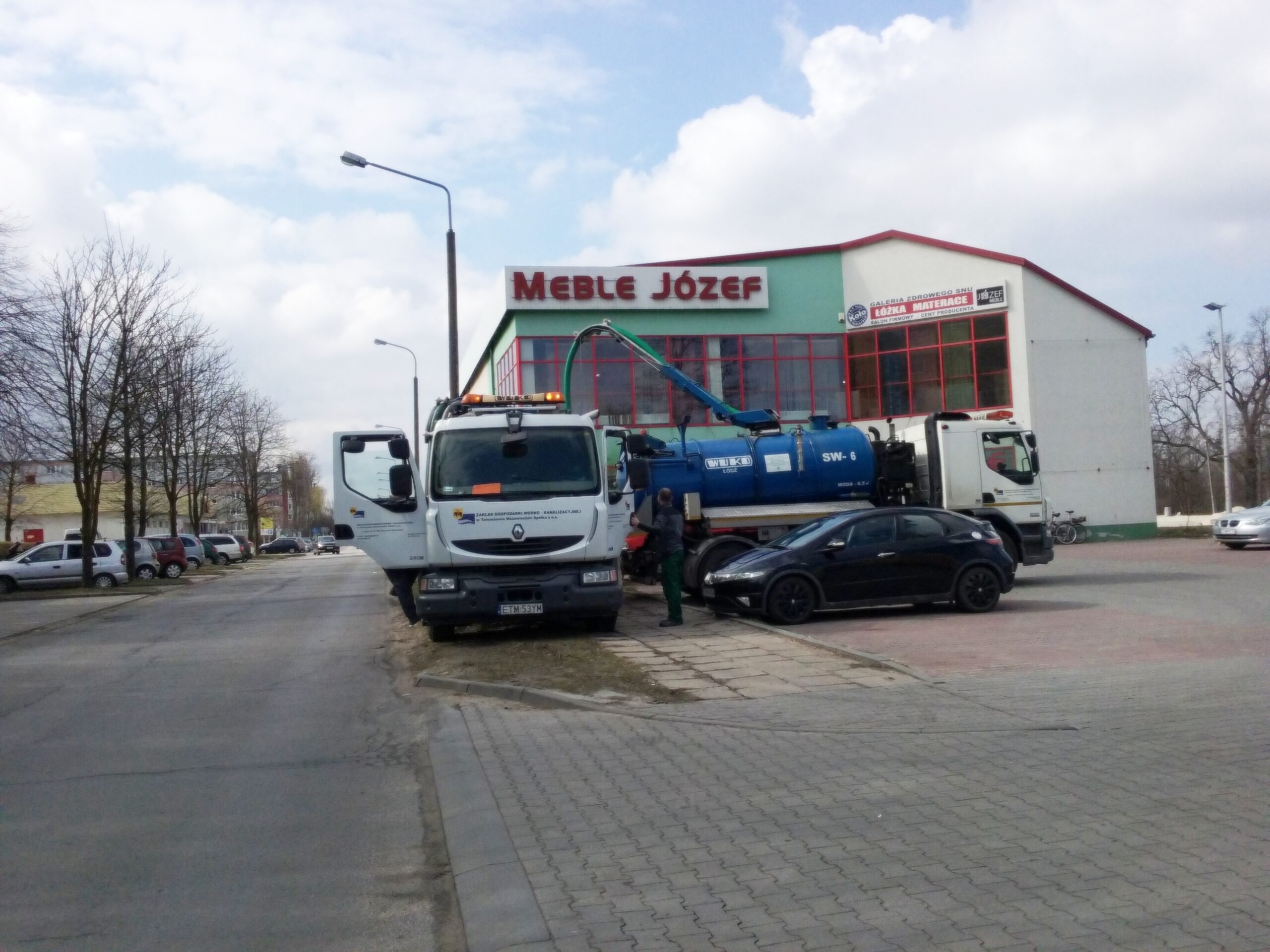 Crew excavating a city street for water supply pipe works, illustrating AI water leak detection in utility networks