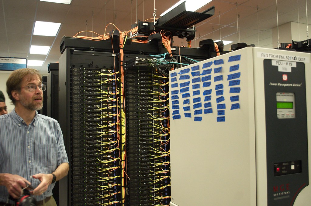 Data centre server racks and network cabling, the kind of systems AI agents talking to each other targeted in 2026