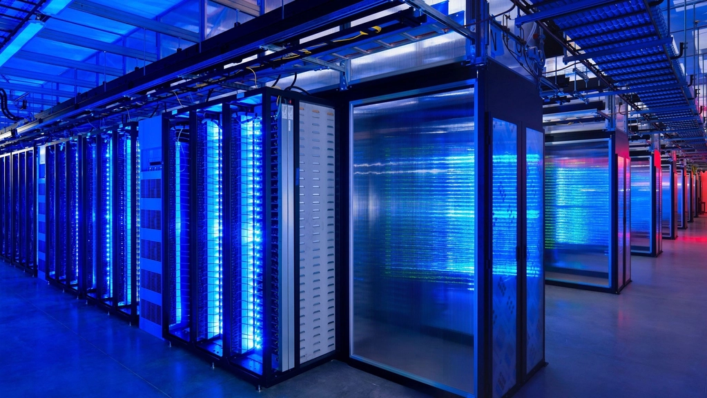 Rows of glowing blue servers in a data center where AI models run and downgraded answers could be served