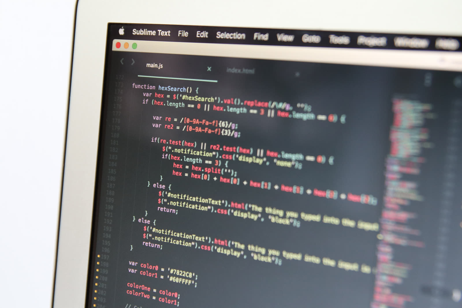 Close-up of code on a laptop screen, illustrating how fake AI models hide malware inside downloaded files