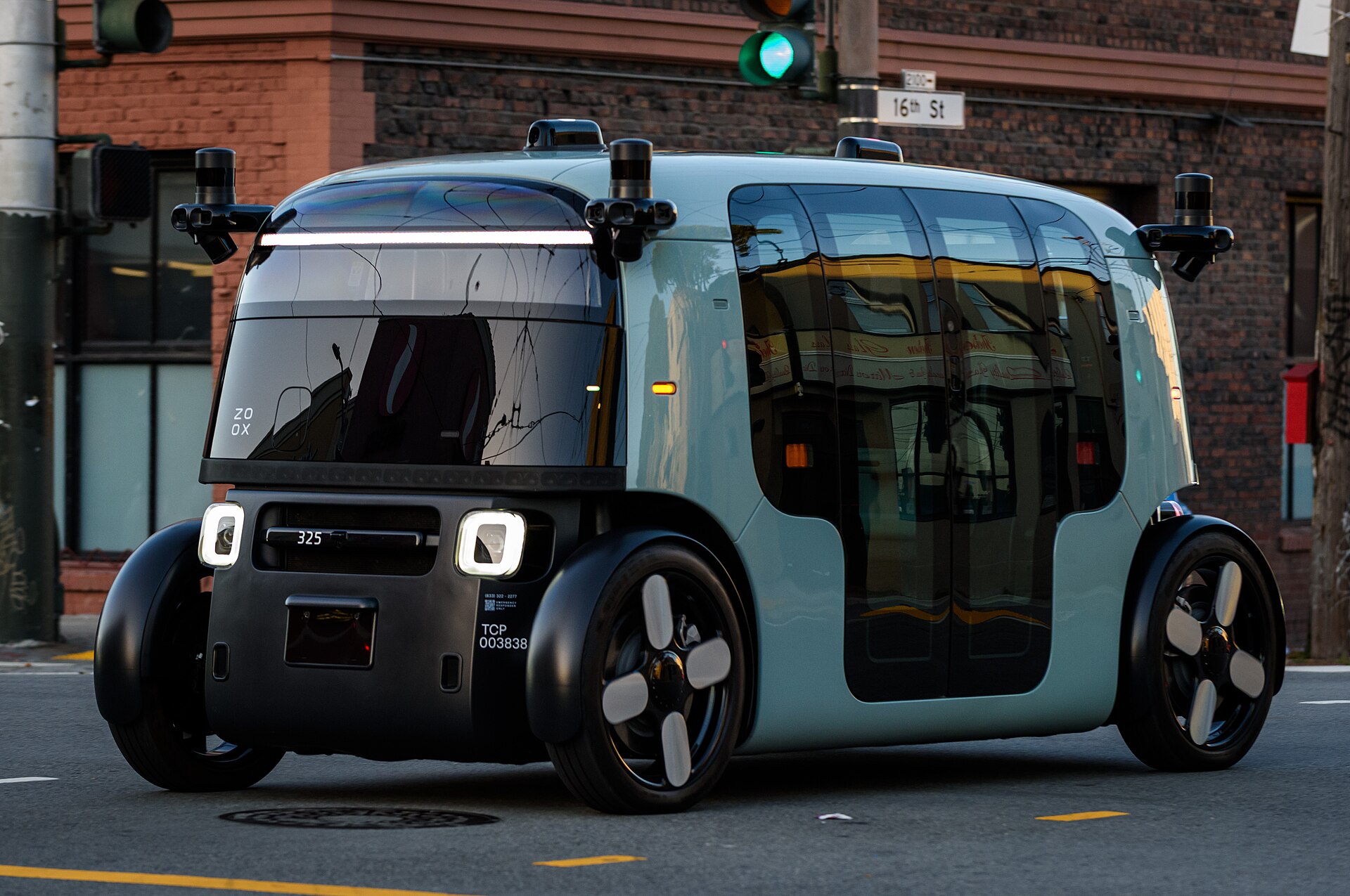 A Zoox self-driving car with no steering wheel parked on a San Francisco street