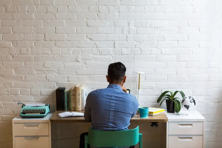 Rows of office workers at desks, illustrating Meta AI layoffs and jobs