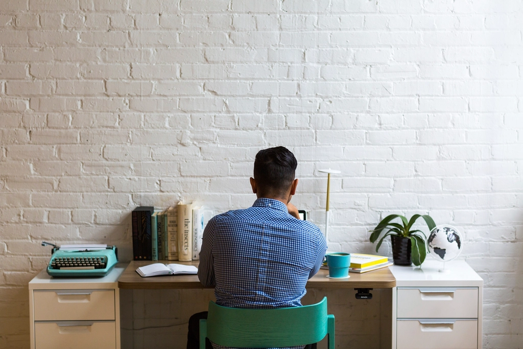 Rows of office workers at desks, illustrating Meta AI layoffs and jobs